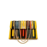 Asake Asooke bag in yellow aso-oke with patchwork leather strips and gold chain strap