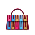 Asake Asooke bag in magenta aso-oke with pink, blue and gold strips and top handle